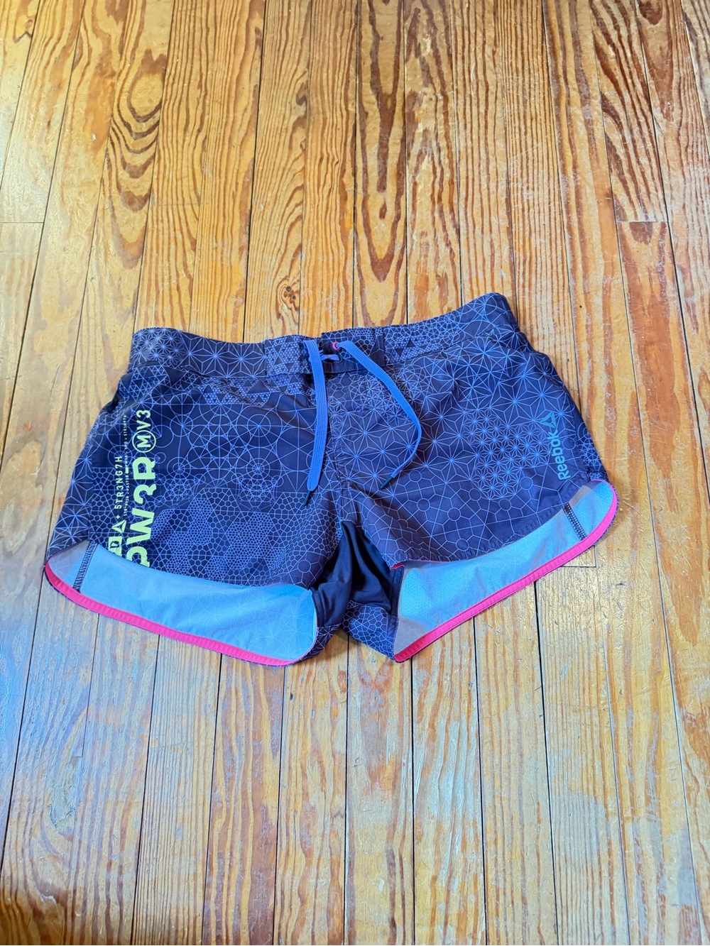 Reebok Women’s Black Athletic Shorts with Blue and Pink Trim